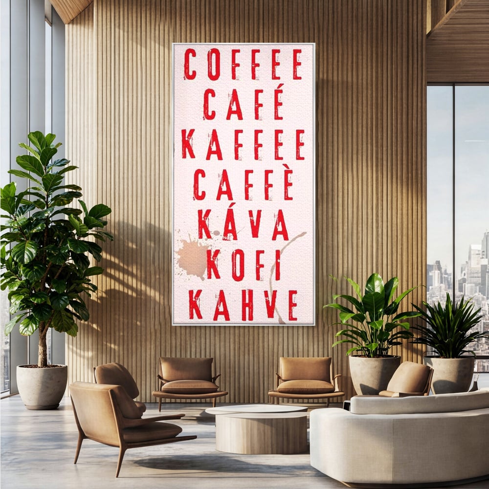Tablou canvas cu tablou canvas cu tipografie cafea in sapte limbi, in rama de aluminiu argintiu, pe perete intr-un birou